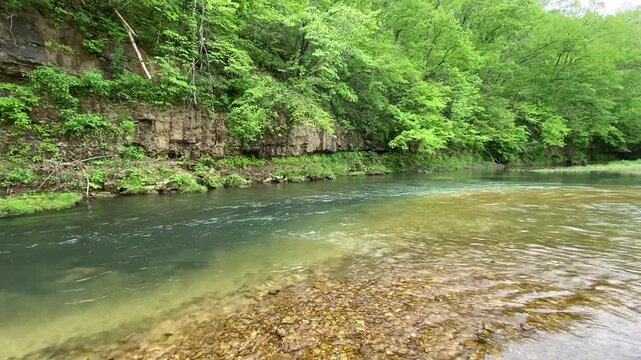 Current river in the forest of the ozarks with clear blue water