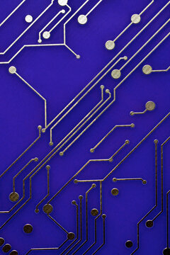 Closeup of purple circuit board with conductor traces