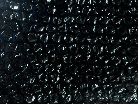 Black bubble wrap texture background for packaging and protection concept. Full frame background.