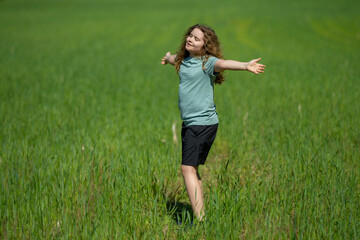 Fototapeta premium Kid enjoys mindful outdoor freedom. Kid breathes fresh summer air. Happy kid feels calm meditation. Playful kid shows carefree joy.