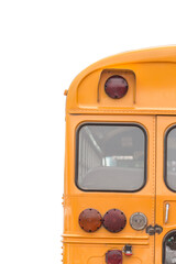 A bright yellow school bus is visible from the rear, set against a white backdrop © Maria