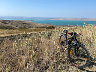 Bike standing on a hill near lake. Panoramic aerial view © Maria