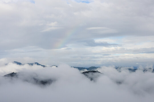 Mountain cloud mist rainbow landscape sky Mountain cloud mist rainbow landscape sky create serene aerial view above rugged peak and forested ridge, with layered vapor beneath softly textured