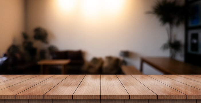 Empty wooden table top with lights bokeh on blur restaurant background.