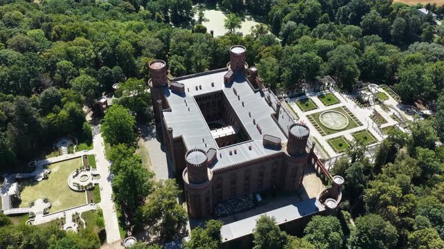 Aerial drone view of the historic Kamieniec Zabkowicki Palace in Lower Silesia, Poland, featuring monumental architecture, landscaped gardens and historic surroundings