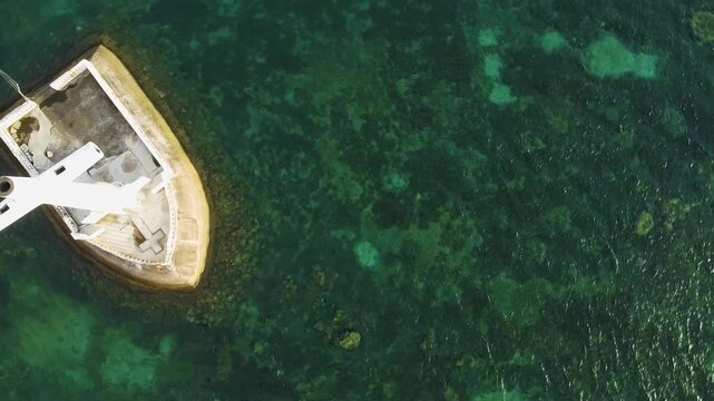 Aerial top view of the sunken cemetery cross in camiguin, philippines