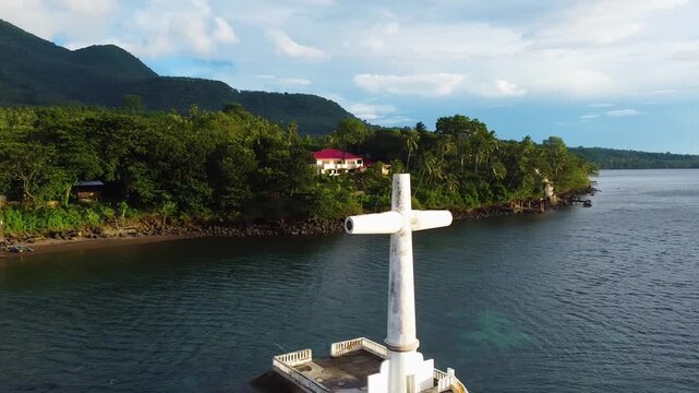 Aerial view of sunken cemetery cross in camiguin, philippines