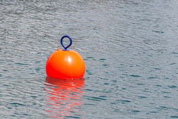 Red Buoy for safety swimming in water © Maria