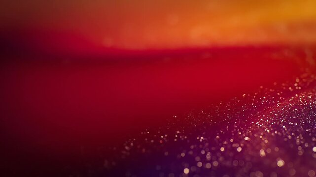 Abstract colorful background with vibrant orange red and purple bokeh lights and glitter particles