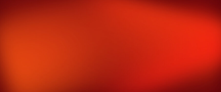 Abstract blurred background with shades of vibrant red and warm orange tones