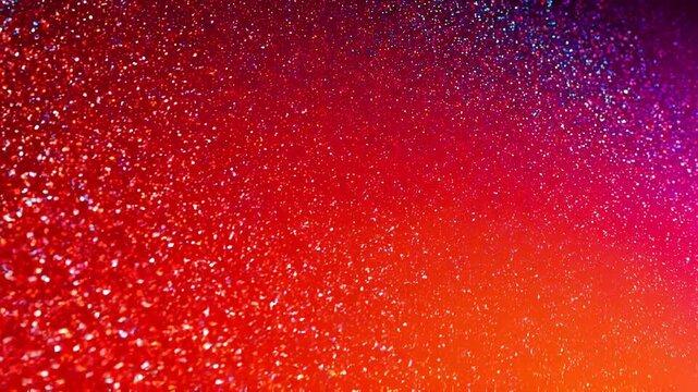 Vibrant red and purple sparkling glitter texture background with bright colorful light effects