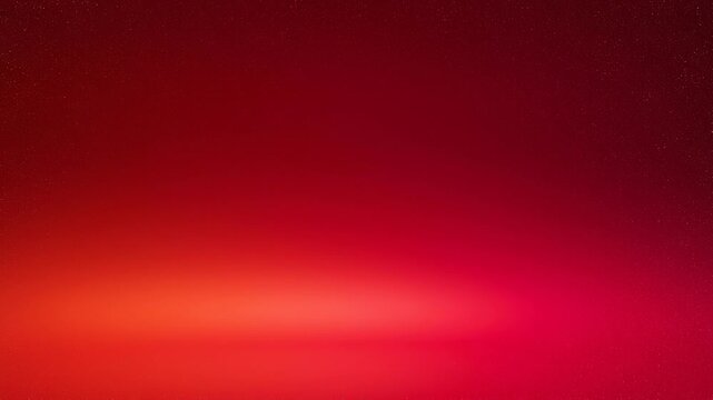Abstract red gradient background with soft glowing light and subtle texture for creative design