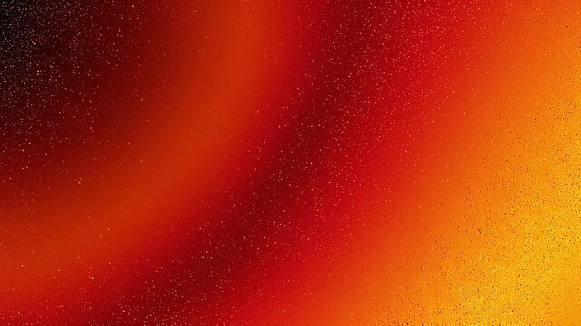 Abstract colorful background with red orange and yellow gradient and tiny scattered dots