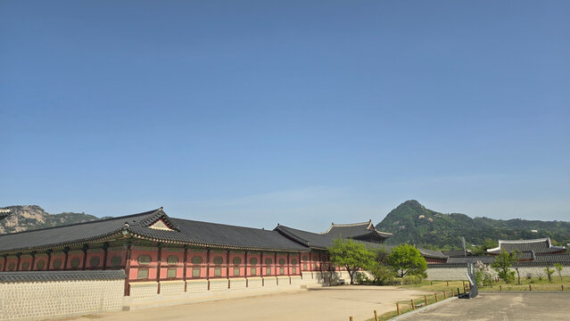 Traditional Korean Hanok tiled rooftops scenic view with mountain landscape background