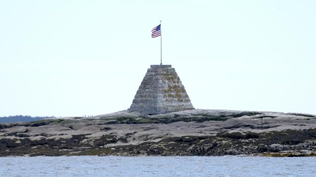 Bunker Ledge Monument with American Flag on Rocky Island