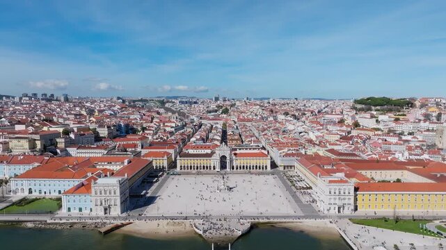 Stunning aerial Shot of Lisbon Praca do Comercio and Rua Augusta Arch, revealing sunlit cityscape, vibrant plaza, striking architecture, and dynamic urban energy.