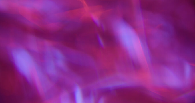 Defocused glow light. Art flare. Pink blue purple colorful lens glisten rainbow radiant kaleidoscope on abstract neon bokeh background.