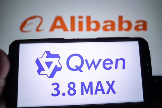Alibaba and Qwen AI logos on screens.