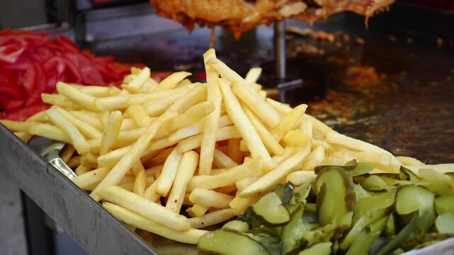 Crispy fries and pickles served at street food stall