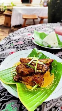Depok, West Java, Indonesia - October 27 2025: High quality 1080p 60fps footage capturing the atmosphere of serving authentic traditional food and beverages. Perfect for documentaries.
