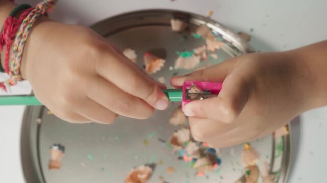 Child Sharpening Colored Pencil by Hand, Developing Fine Motor Skills and Responsibility