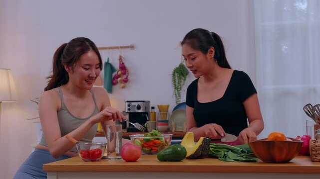 Woman kitchen vegetable cooking salad friend home healthy food preparation cheerful group preparing fresh meal with fruit bowl utensil counter bright room healthy lifestyle food prep