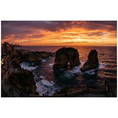 Fototapeta premium Pigeon Rocks Raouche at sunset Beirut Lebanon Dramatic coastal sunset with rock formations