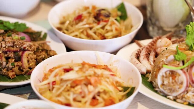 Traditional Thai Isan Cuisine with Som Tum and Larb Moo