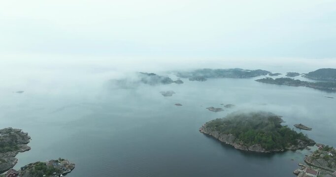 Aerial view of misty fjord islands in H&oslash;llen Norway showing bird s eye view