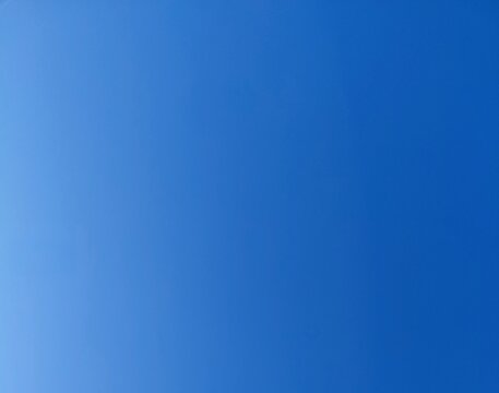 Clear blue sky background with smooth gradient