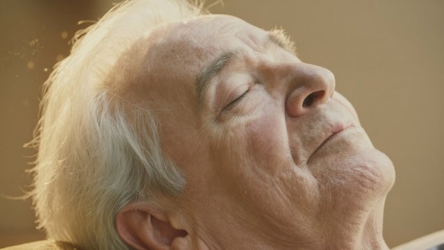 Serene Elderly Man Enjoying Peaceful Moment of Relaxation Indoors