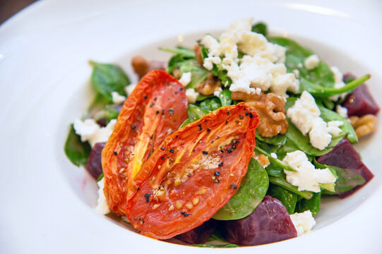 Spinach Salad with Roasted Tomatoes, Feta, Walnuts, and Beets