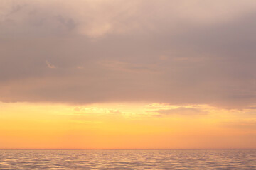 Fototapeta premium calm golden sunset over the sea
