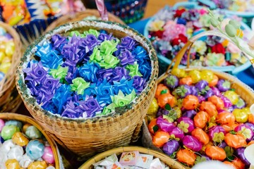 Fototapeta premium Colorful Easter Eggs in a Basket for Festive Spring Holiday Celebration and Sweet Decoration