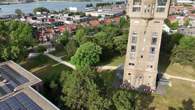 Drone tilt movement showcasing tower and cityscape