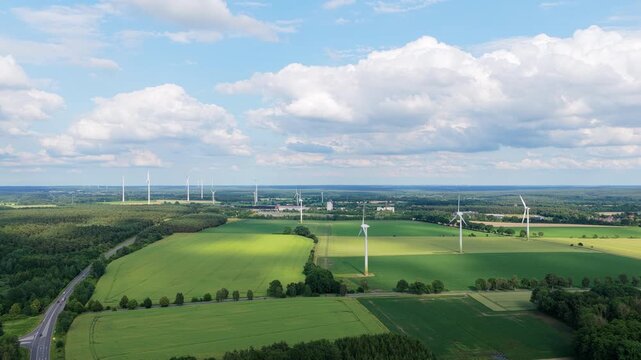 Wind mill for renewable electric energy production. Wind mill for renewable electric energy production. Windmill in a rural area. Offshore wind park. Alternative renewable energy generation
