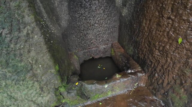 Ancient Rock Cut Water Cistern Tank Filled with Rainwater at Kuda Caves