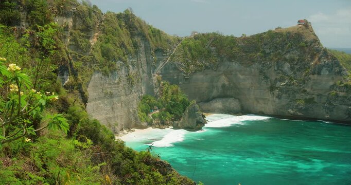 Scenic coastal view of white sand and turquoise ocean at Diamond Beach in Nusa Penida Bali