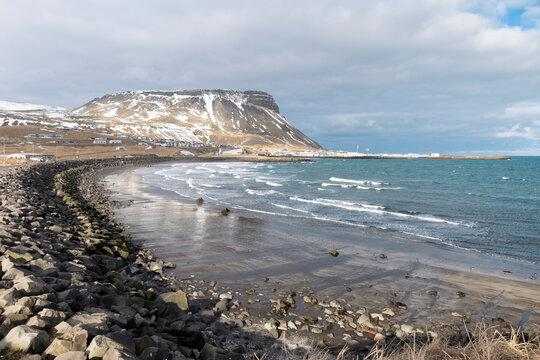 Panoramic coastline with black lava rocks and bright sand at Budir Bay, snaefellsnes peninsula, Iceland