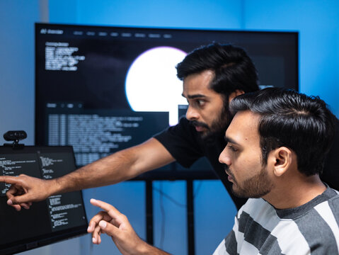 Team engineers software development are brainstorming using computer writing code. Programmer teamwork meetings using technology artificial intelligence work system about cyber security and coding 