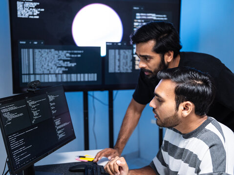 Team engineers software development are brainstorming using computer writing code. Programmer teamwork meetings using technology artificial intelligence work system about cyber security and coding 