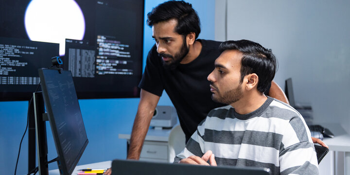 Team engineers software development are brainstorming using computer writing code. Programmer teamwork meetings using technology artificial intelligence work system about cyber security and coding 