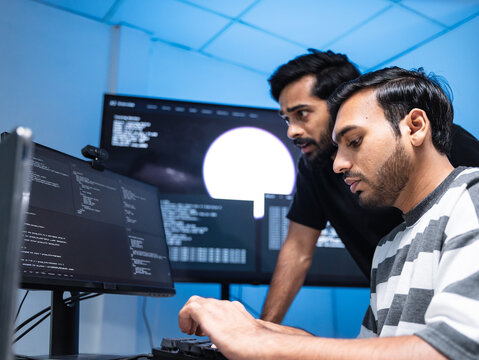 Team engineers software development are brainstorming using computer writing code. Programmer teamwork meetings using technology artificial intelligence work system about cyber security and coding 