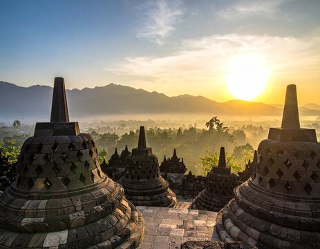 Borobudur temple stupas at sunrise misty valley mountain landscape yogyakarta historic indonesia