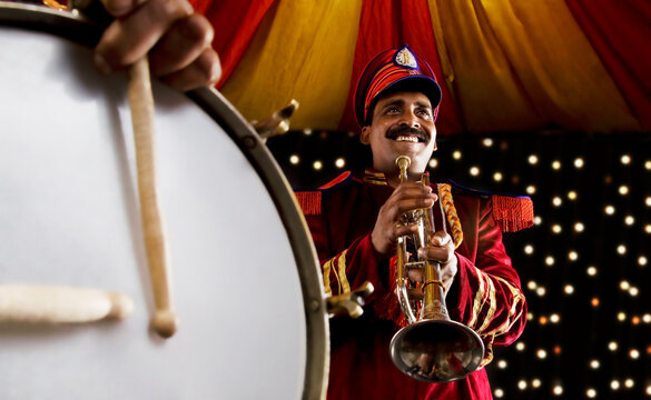 Bandmaster holding a trumpet 