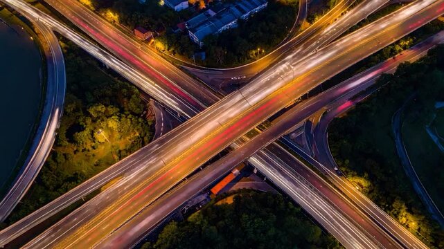 Aerial view of a complex highway intersection, long exposure, with light trails