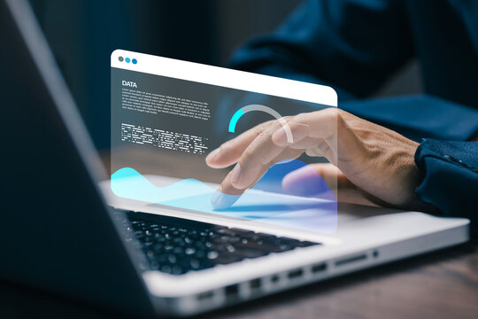 Business professional analyzing a virtual data dashboard on laptop, representing digital analytics, business intelligence, performance monitoring, technology, and data driven strategy.