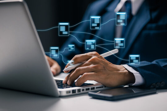 Business professional using laptop with connected digital document icons, representing document management, data sharing, cloud workflow, file organization, and business automation.
