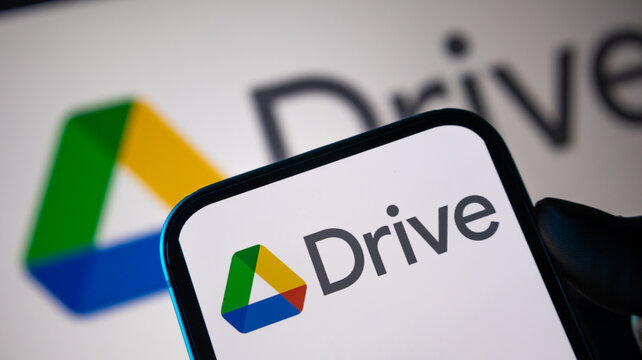 Google drive logo icon presented on smartphone screen for cloud storage and digital file management technology.
