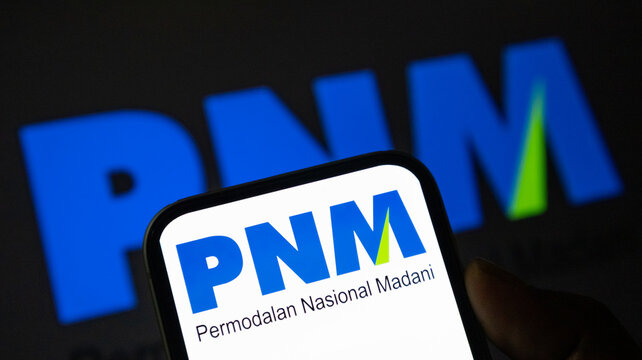 PNM Permodalan Nasional Madani logo on a smartphone screen representing financial services and microfinance.
